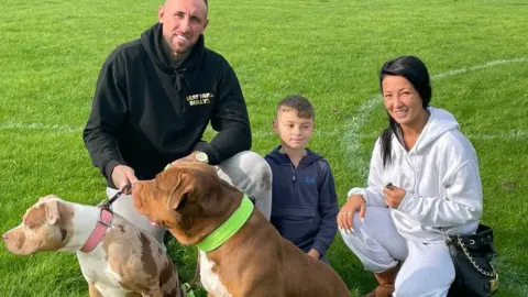 Family with American Bulldog